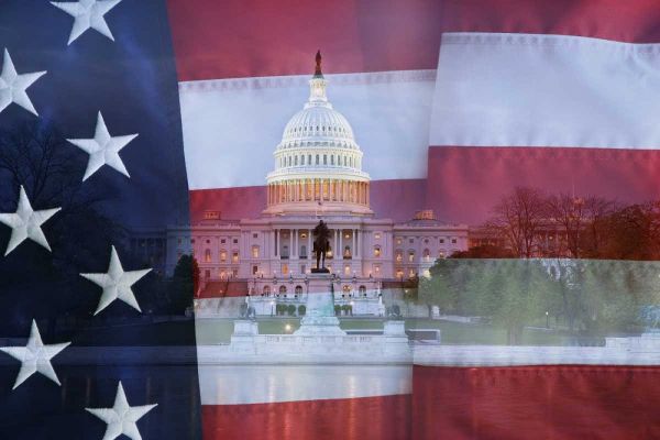 Washington DC, US flag over US Capitol buildings